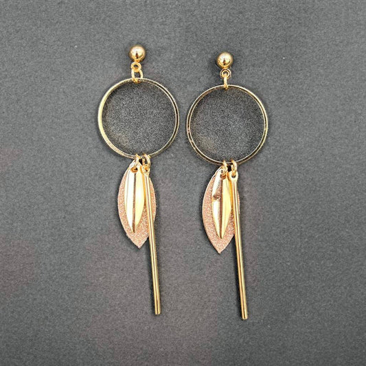 Gold colored earrings with glitter